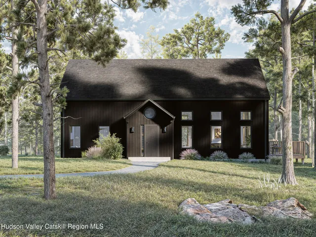 front view of a house with a yard
