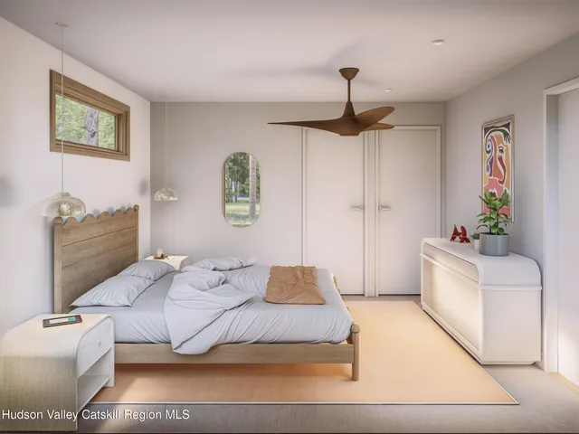 a bedroom with a bed and a couch