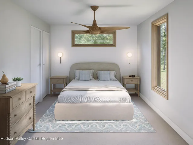 a bedroom with a bed and window