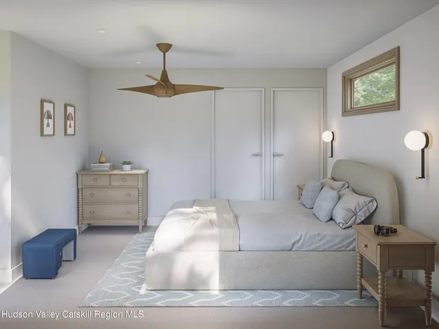 a bedroom with a bed and a couch