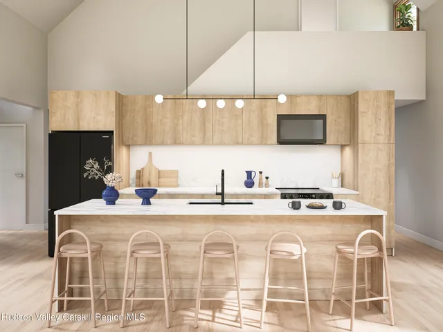 a kitchen with stainless steel appliances granite countertop a sink a stove a microwave a counter top space and cabinets