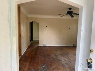 7588 Pelham Road Taylor, MI 48180 - Photo 7 of 20 Expansive interior with wood-finish flooring, arched doorways, and a ceiling fan