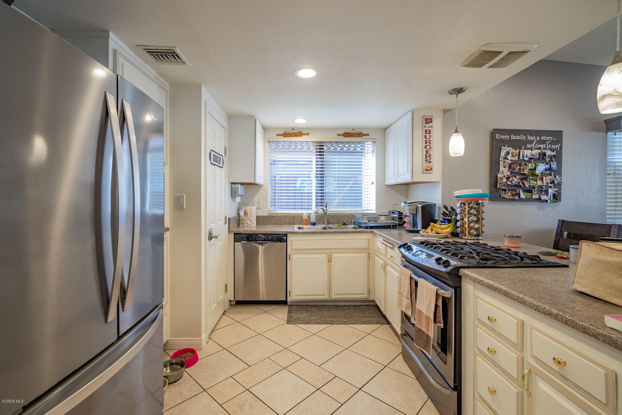 6116 Al Way Simi Valley, CA 93063 - Photo 15 of 55 a kitchen with a sink stove and refrigerator