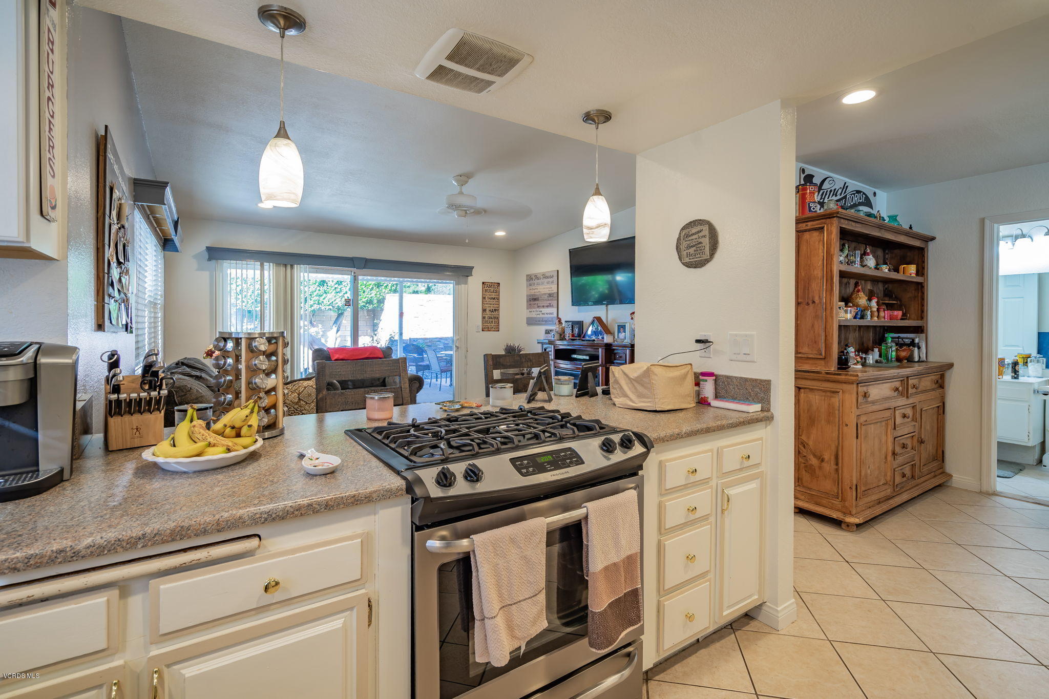 6116 Al Way Simi Valley, CA 93063 - Photo 16 of 55 a kitchen with stove and cabinets