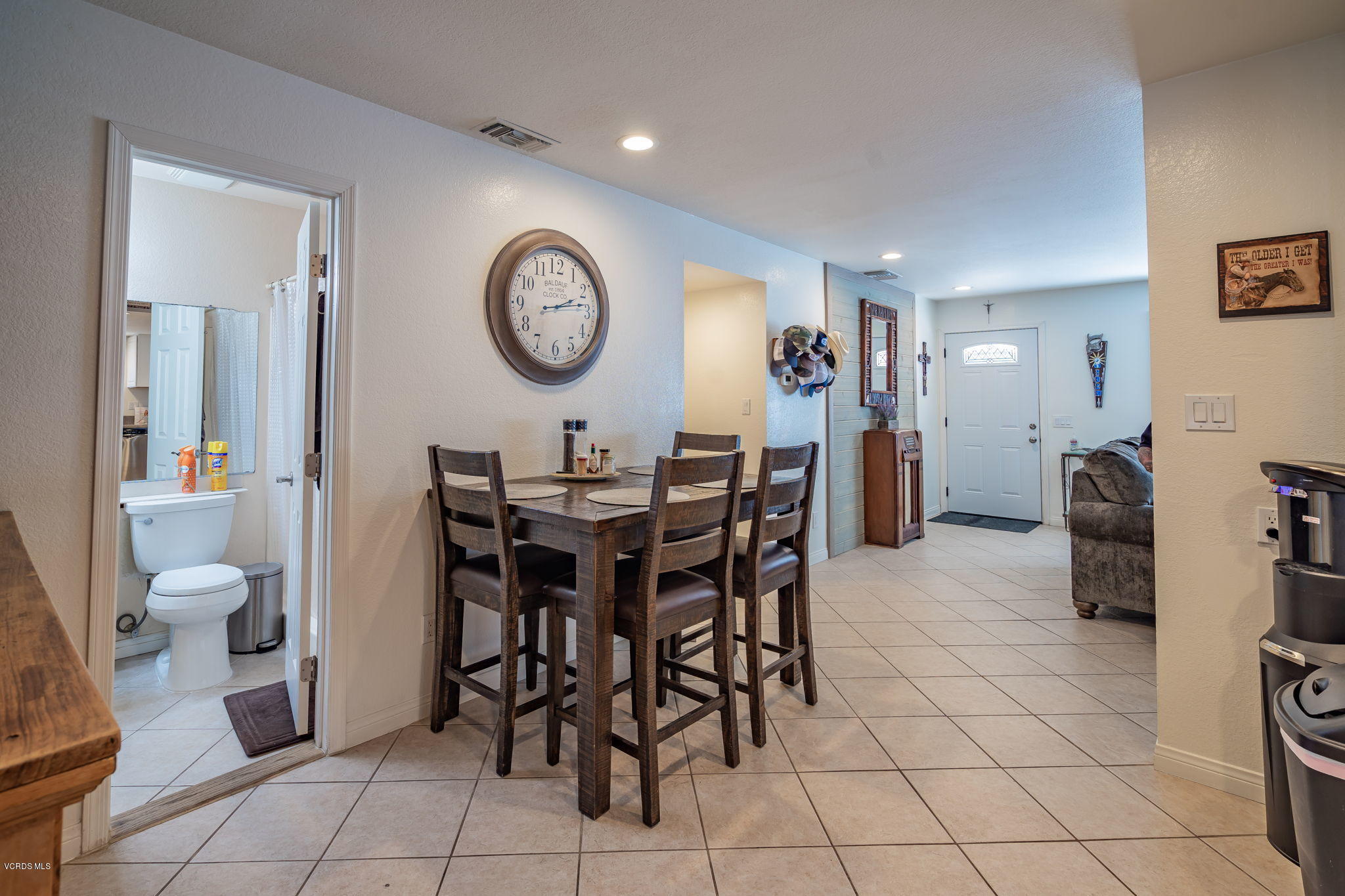 6116 Al Way Simi Valley, CA 93063 - Photo 22 of 55 a view of a dining room with furniture and a large window