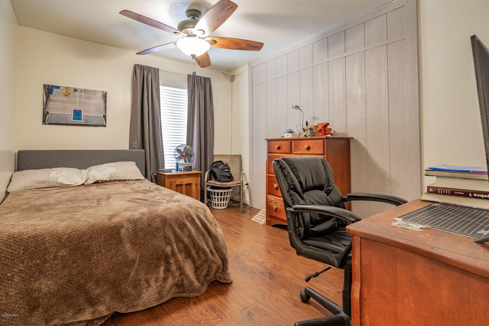 6116 Al Way Simi Valley, CA 93063 - Photo 31 of 55 a bedroom with a bed and a chandelier