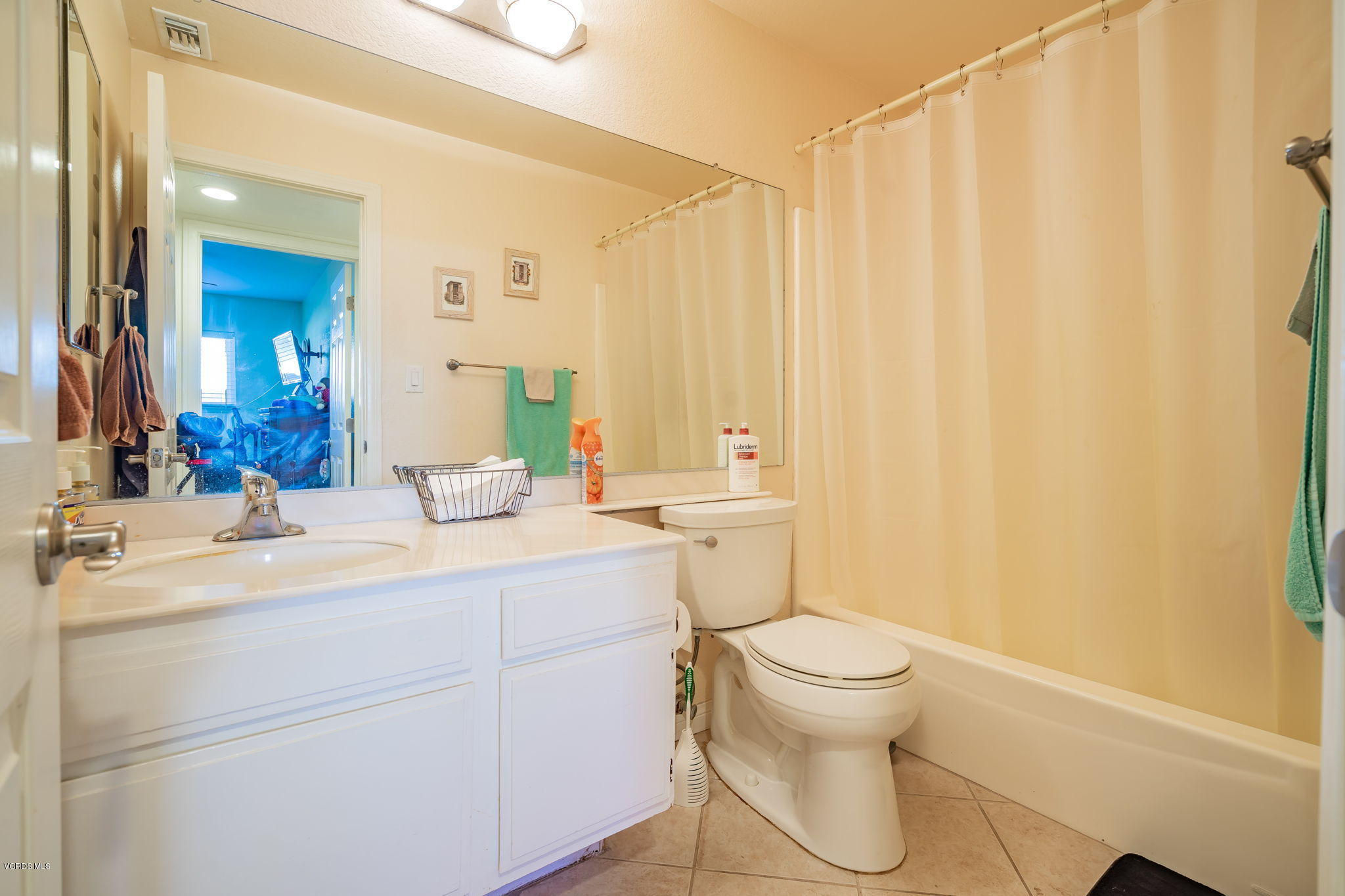 6116 Al Way Simi Valley, CA 93063 - Photo 34 of 55 a bathroom with a double vanity sink toilet and a mirror