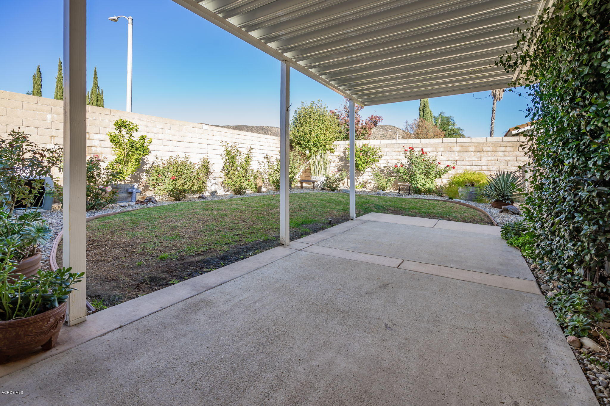 6116 Al Way Simi Valley, CA 93063 - Photo 41 of 55 a view of a backyard with plants and a patio