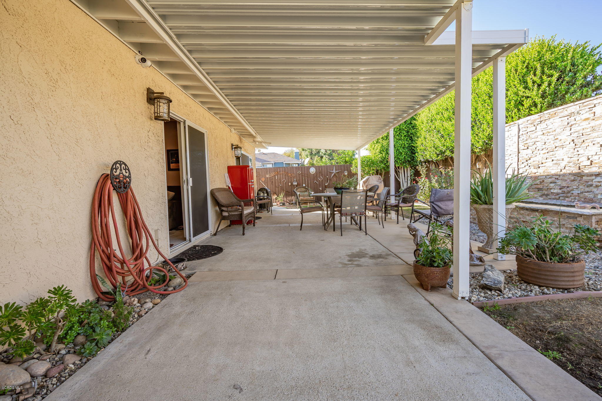 6116 Al Way Simi Valley, CA 93063 - Photo 43 of 55 a view of a patio with table and chairs potted plants