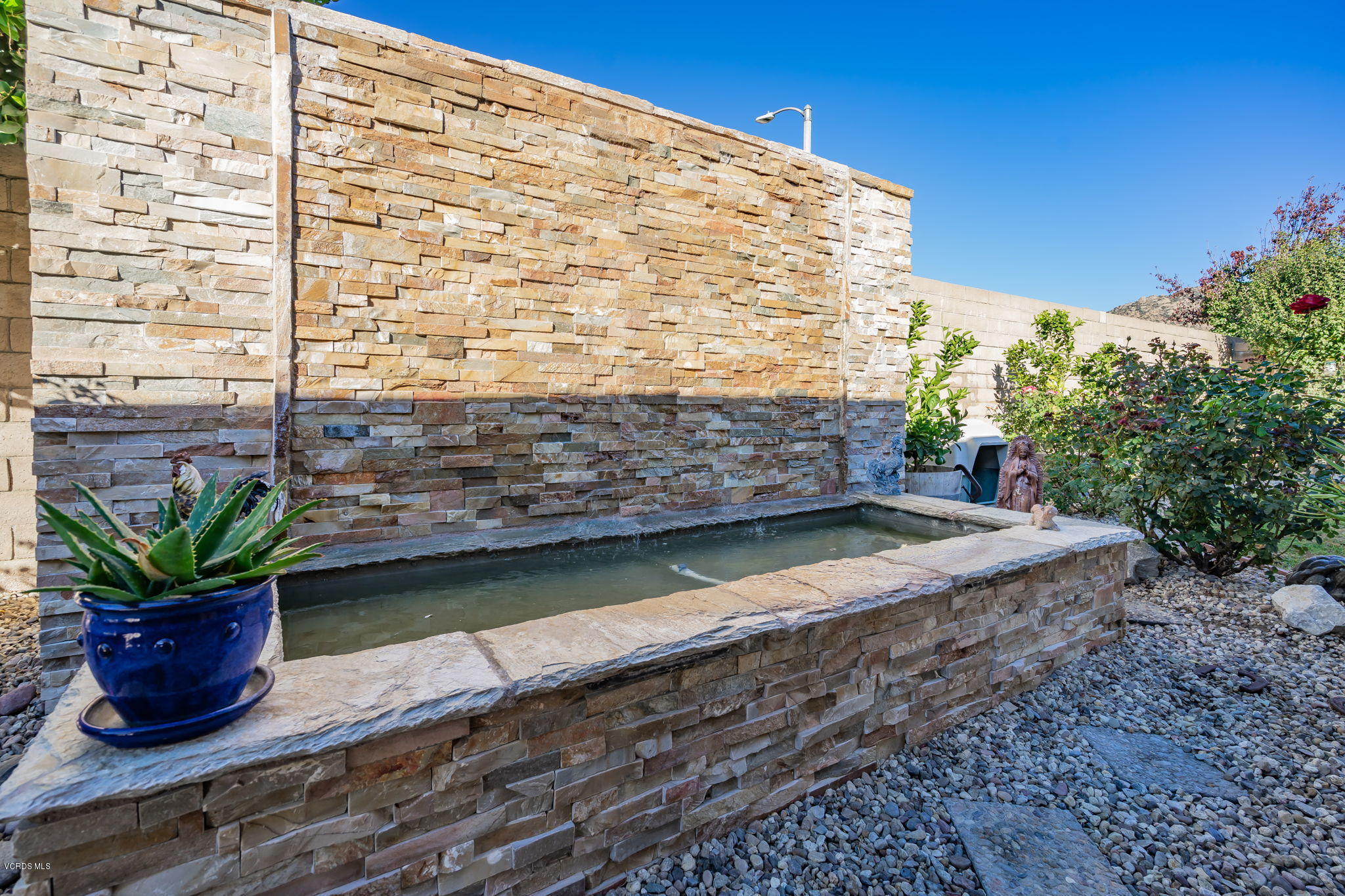 6116 Al Way Simi Valley, CA 93063 - Photo 44 of 55 a view of a building with a potted plant