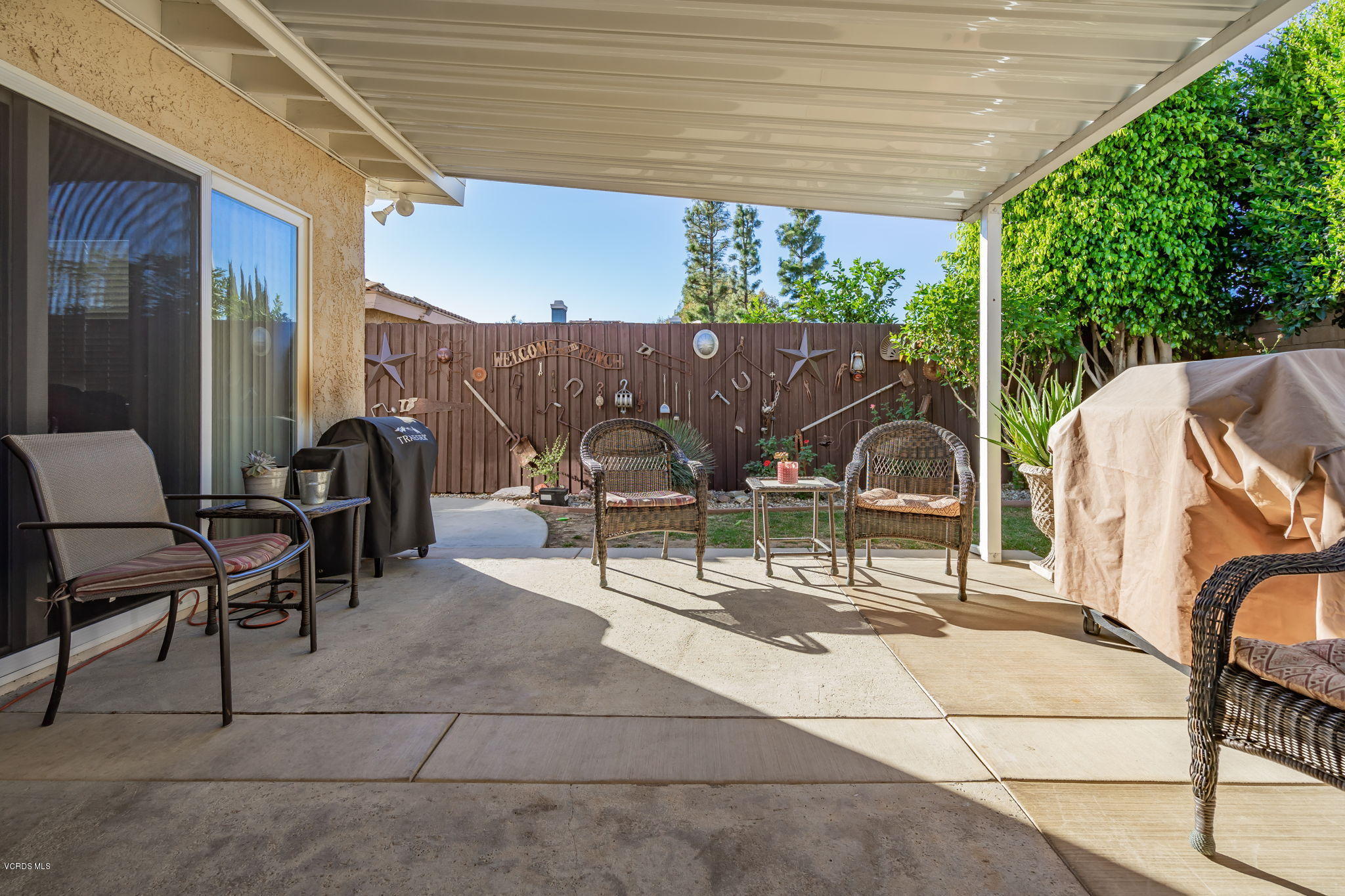 6116 Al Way Simi Valley, CA 93063 - Photo 45 of 55 a view of a patio with table and chairs and potted plants