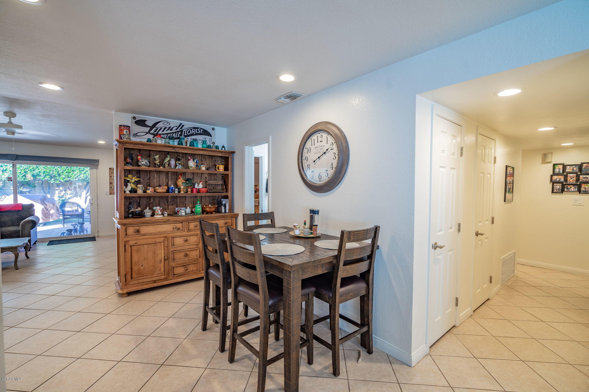 6116 Al Way Simi Valley, CA 93063 - Photo 55 of 55 a view of a kitchen with a dining table and chairs