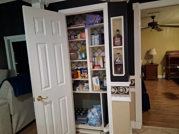 a view of living room with furniture and flat screen tv