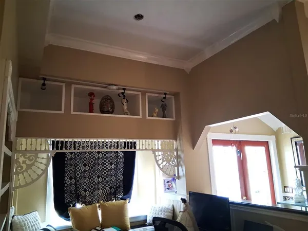 a view of a room with furniture and a window