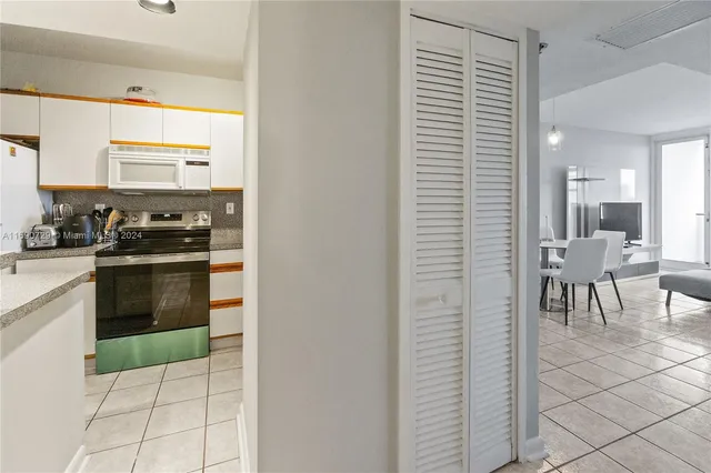 a kitchen with stainless steel appliances a stove a sink and a refrigerator