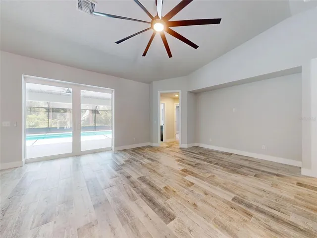 a view of an empty room with a window