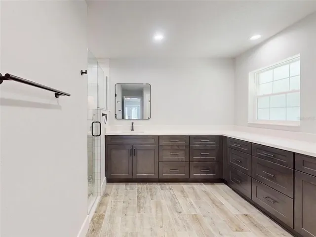 a front view of a house with a yard and glass windows