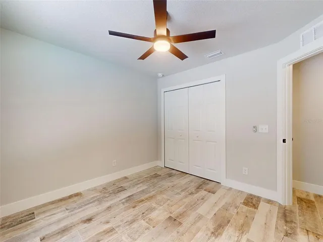 a front view of a house with a garden and yard