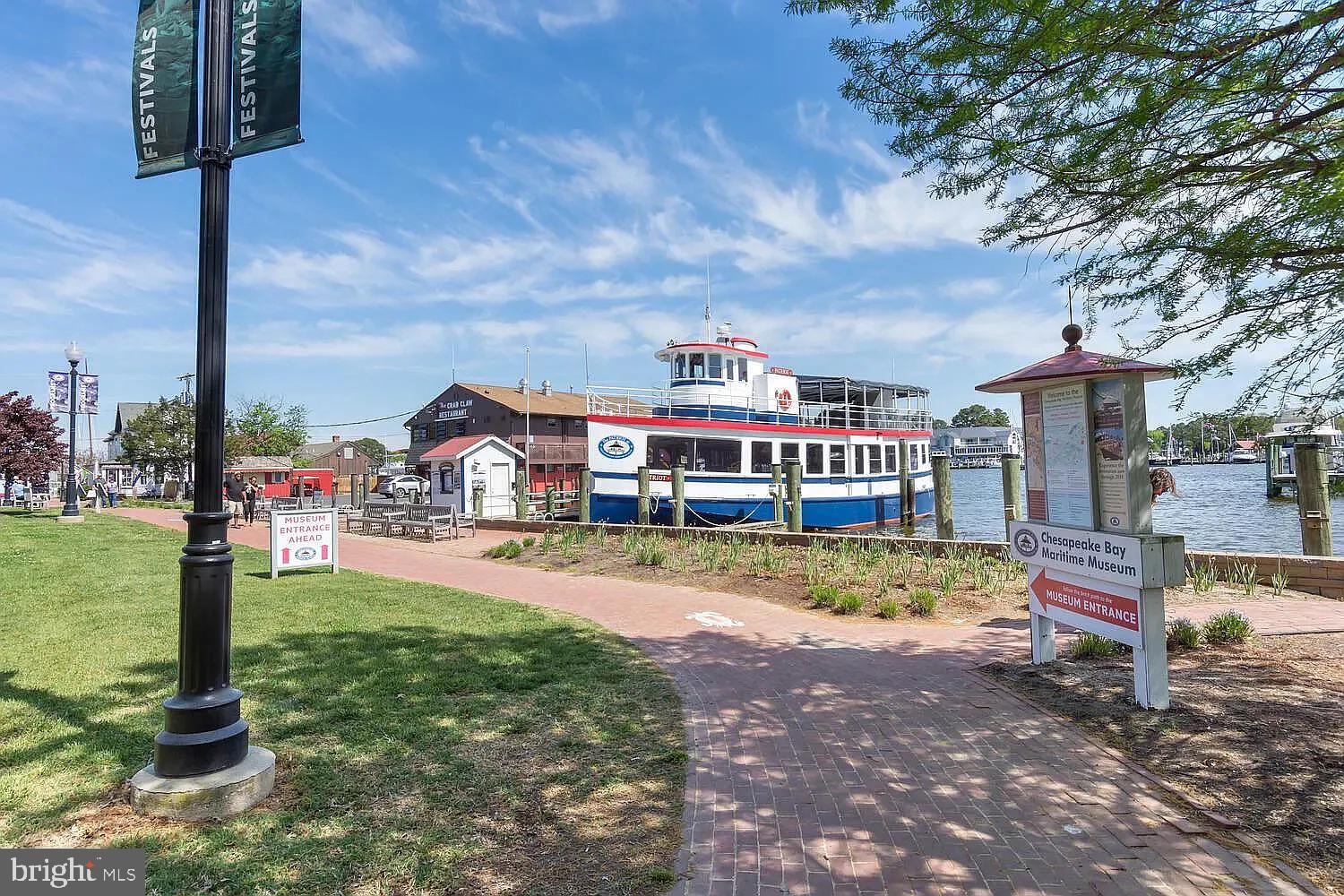 104 East Maple Avenue St. Michaels, MD 21663 - Photo 14 of 14 a front view of a house with a yard table and chairs