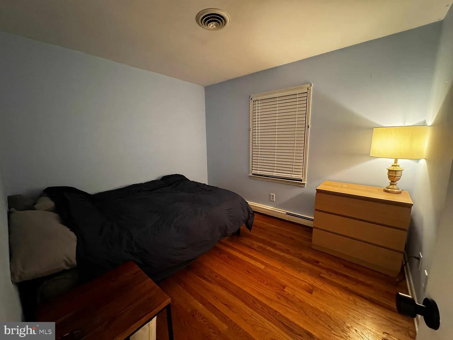 104 East Maple Avenue St. Michaels, MD 21663 - Photo 6 of 14 a bedroom with a bed and a chair