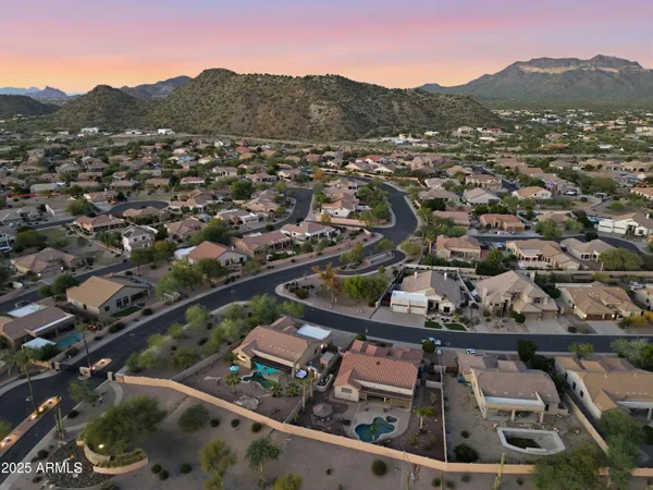 an aerial view of residential houses and city view