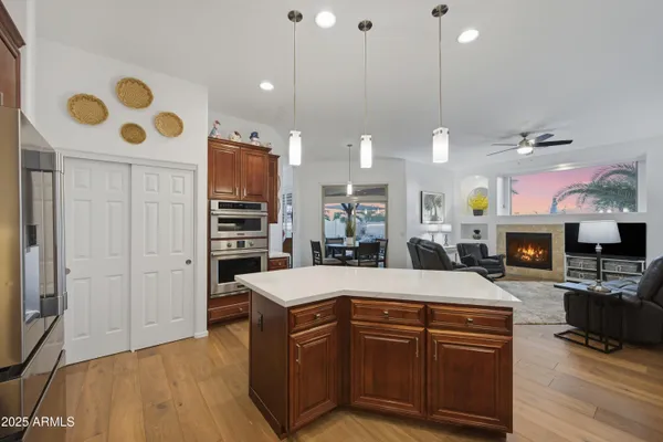 a living room with furniture and a ceiling fan