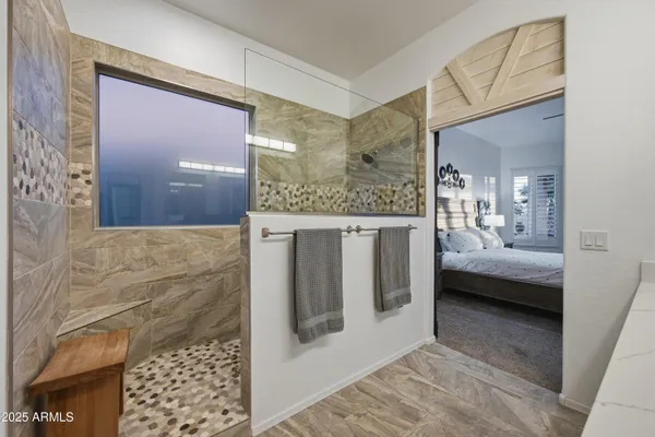 a en suite bathroom with a sink and a mirror