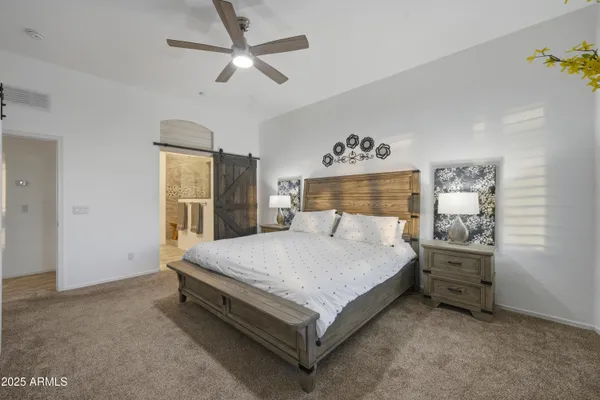 a bedroom with a bed and window