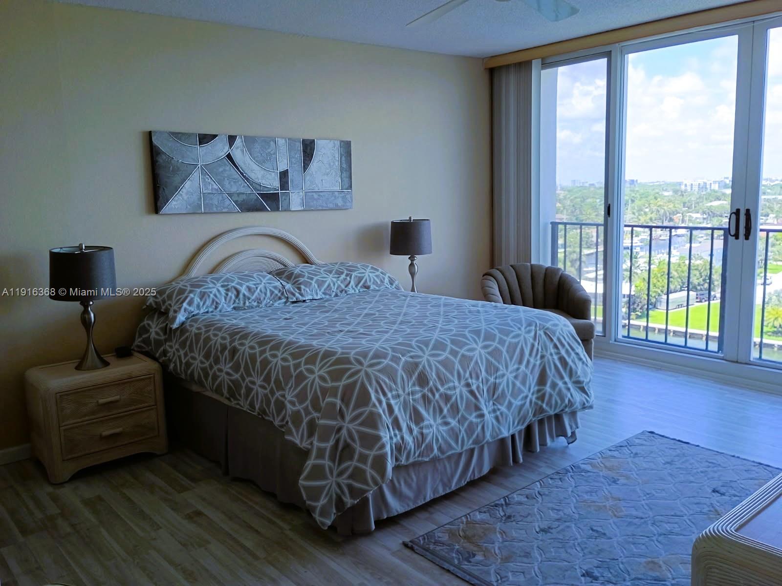 521 North Riverside Drive, Unit 907 Pompano Beach, FL 33062 - Photo 12 of 23 a bedroom with a bed and a couch