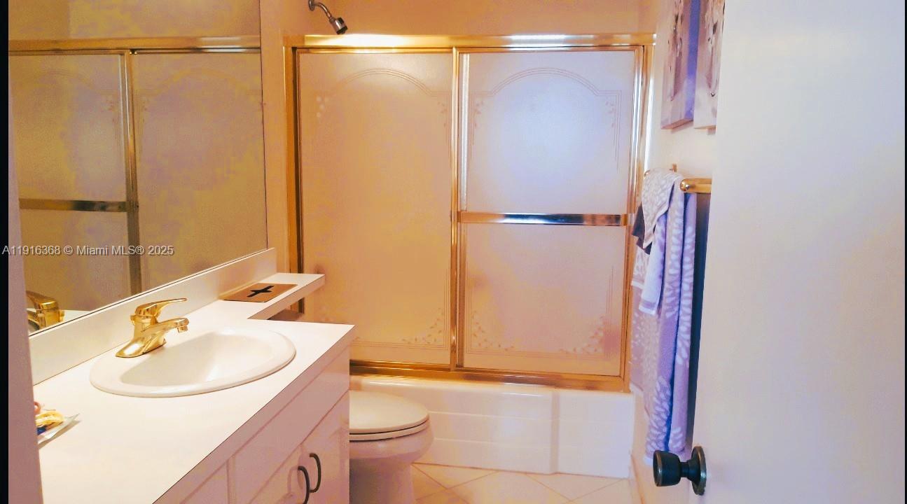 521 North Riverside Drive, Unit 907 Pompano Beach, FL 33062 - Photo 18 of 23 a bathroom with a sink and a mirror