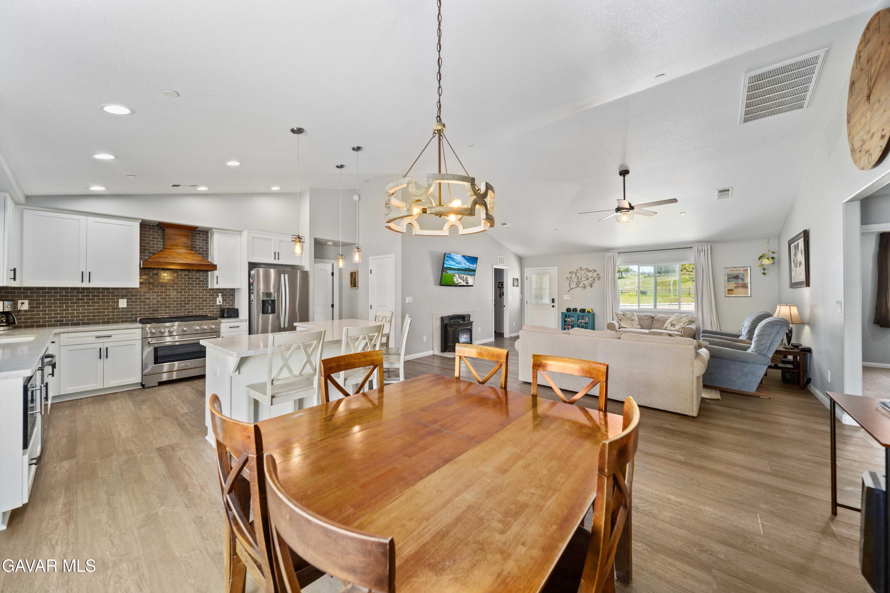 29990 Horsethief Drive Tehachapi, CA 93561 - Photo 14 of 29 a dining room with furniture a chandelier and wooden floor