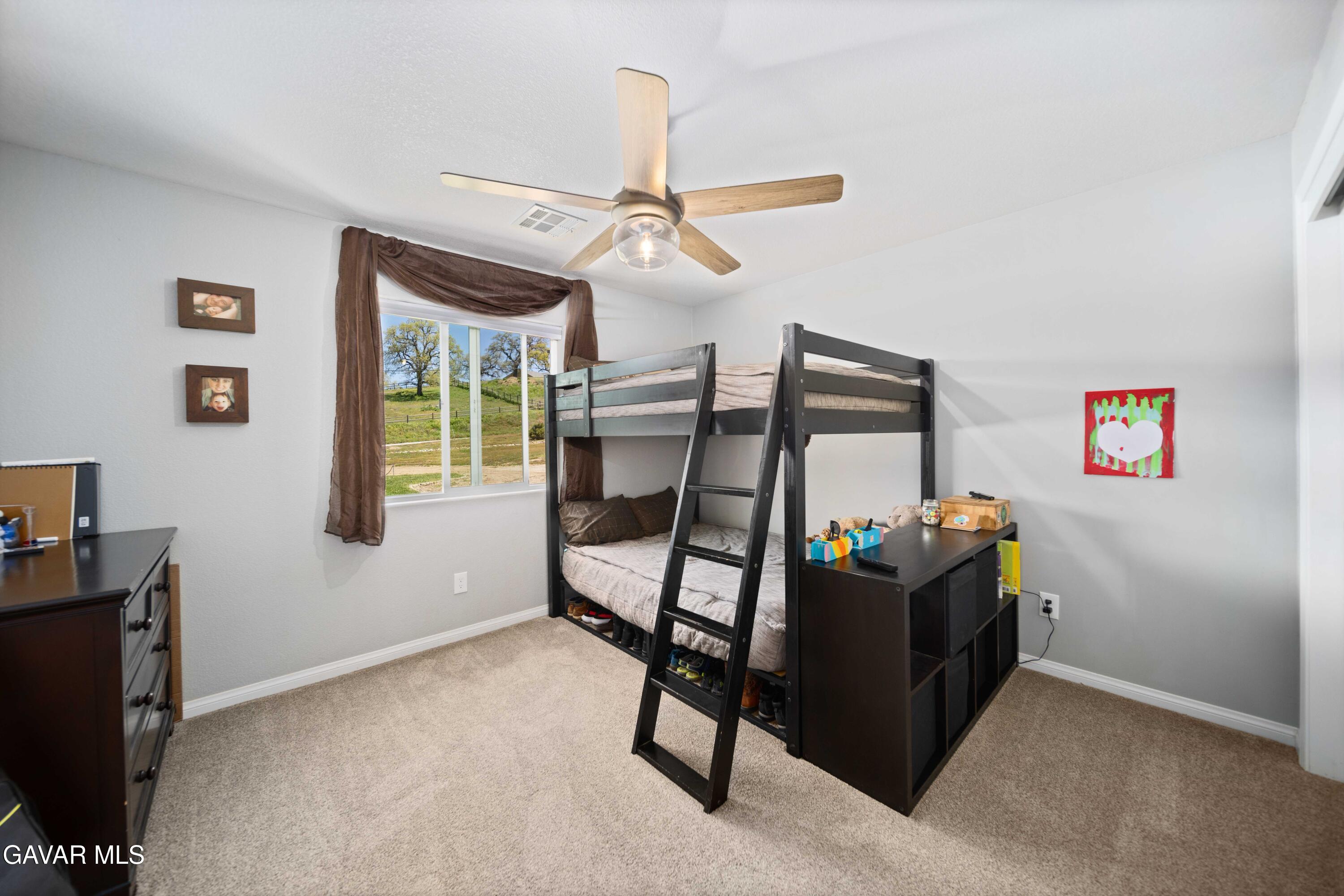29990 Horsethief Drive Tehachapi, CA 93561 - Photo 22 of 29 a bedroom with bunk bed and a window