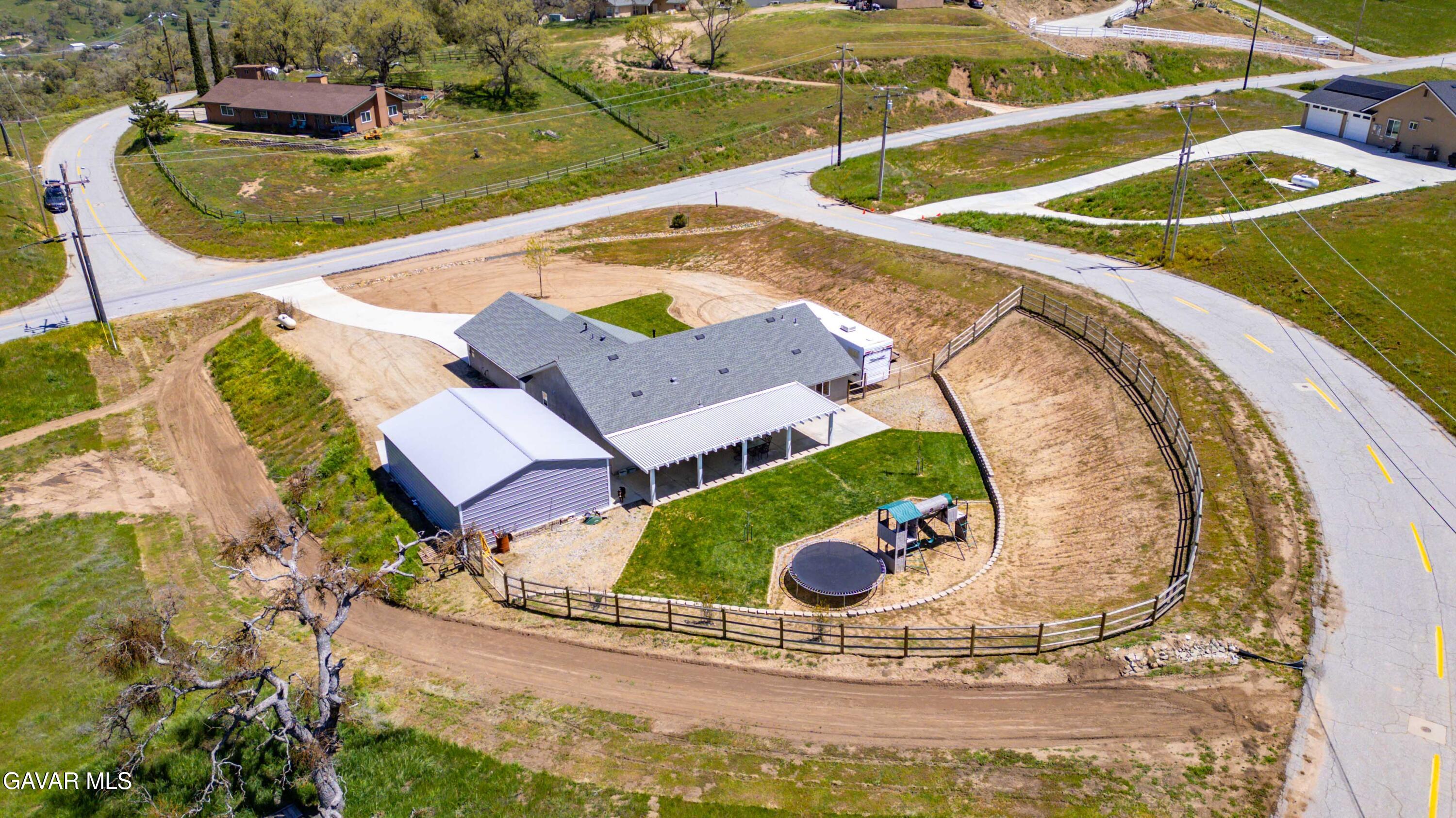 29990 Horsethief Drive Tehachapi, CA 93561 - Photo 28 of 29 an aerial view of a house with a swimming pool