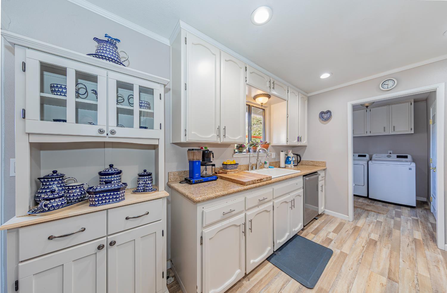 40733 Big Oak Flat Road North Oakhurst, CA 93644 - Photo 11 of 73 a kitchen with cabinets a sink and appliances