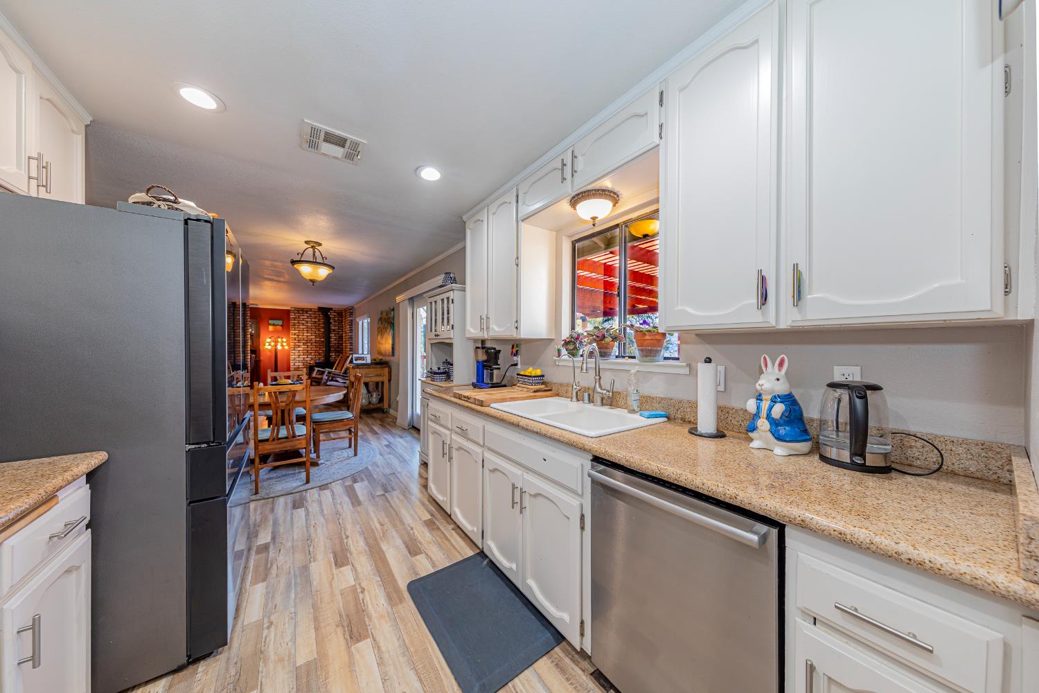 40733 Big Oak Flat Road North Oakhurst, CA 93644 - Photo 13 of 73 a kitchen with stainless steel appliances granite countertop a sink and cabinets