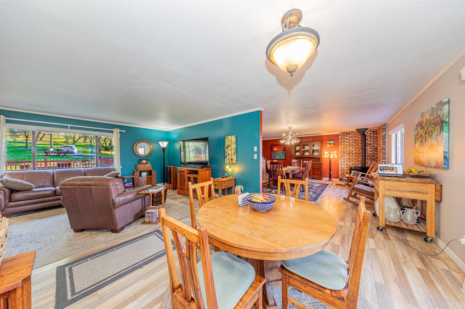 40733 Big Oak Flat Road North Oakhurst, CA 93644 - Photo 15 of 73 a view of a dining room with furniture window and outside view