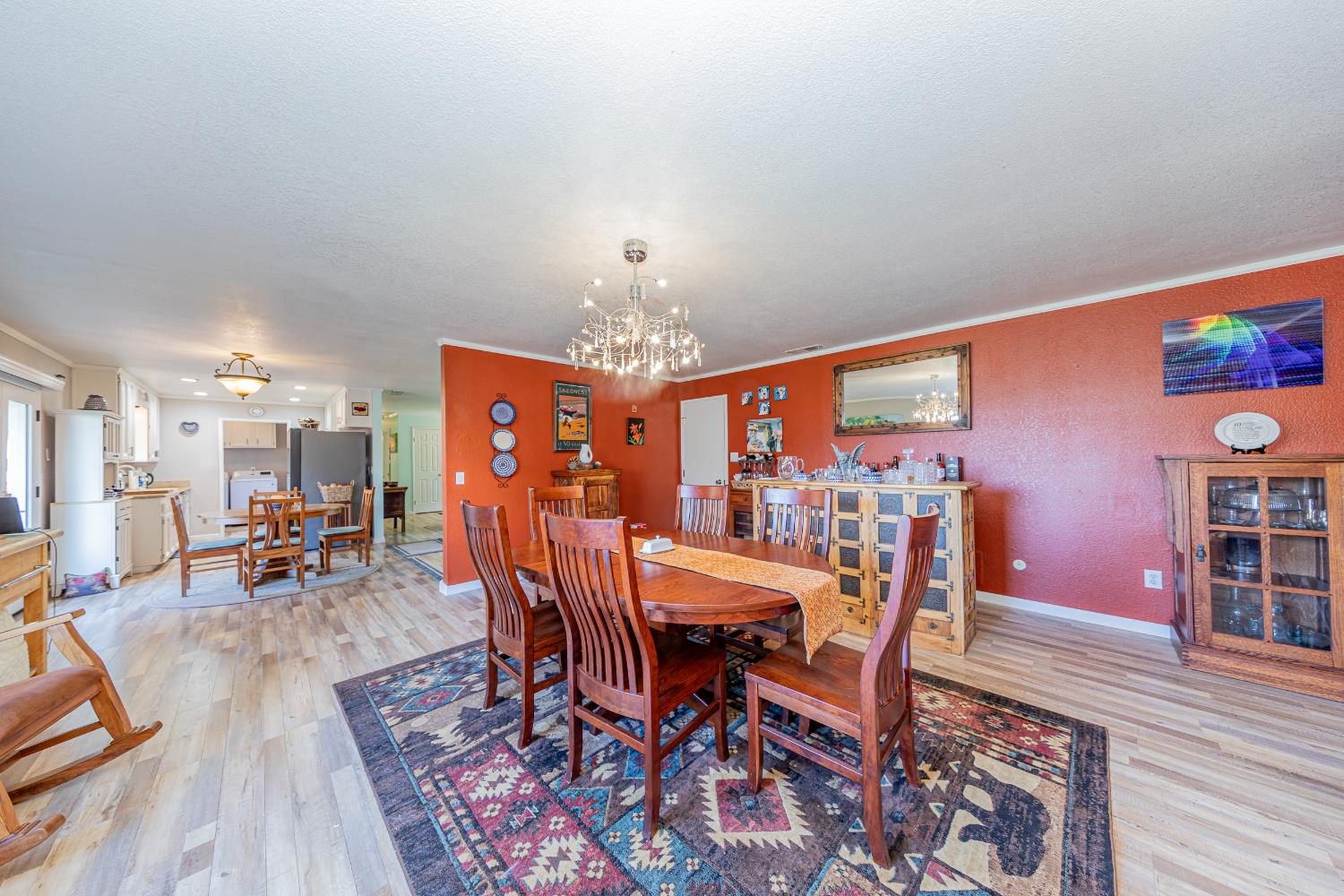 40733 Big Oak Flat Road North Oakhurst, CA 93644 - Photo 20 of 73 a view of a dining room with furniture and wooden floor