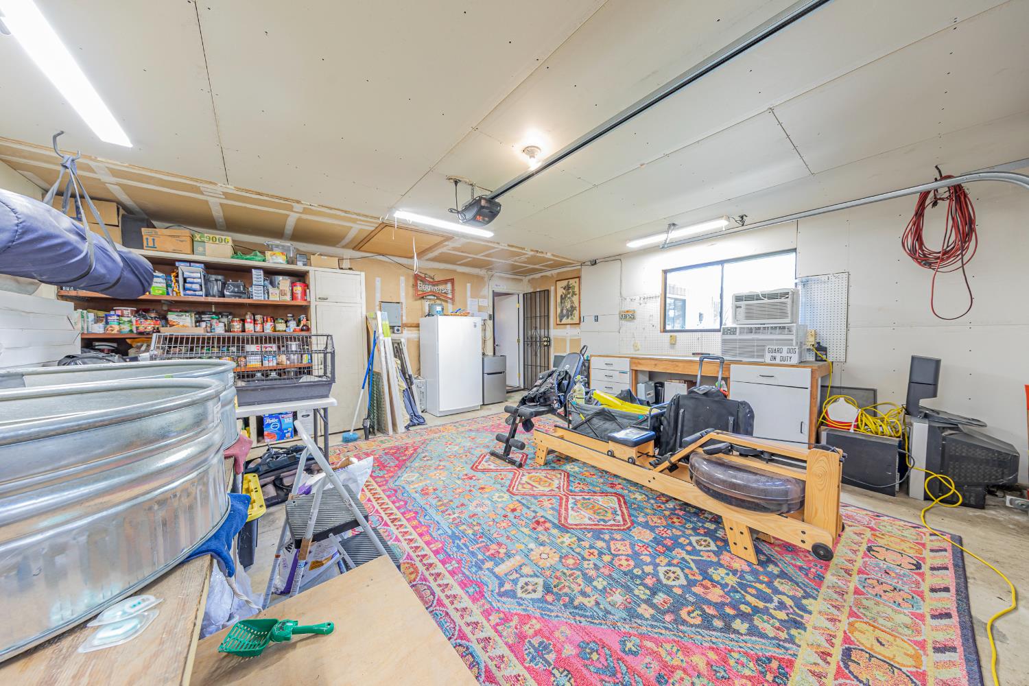 40733 Big Oak Flat Road North Oakhurst, CA 93644 - Photo 35 of 73 a bed room with a bed a table and a chandelier