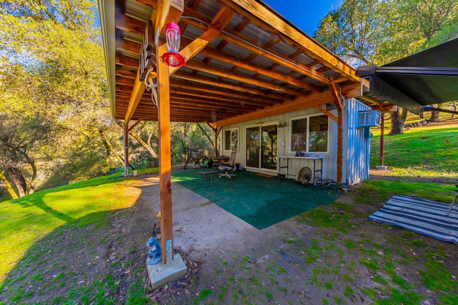 40733 Big Oak Flat Road North Oakhurst, CA 93644 - Photo 39 of 73 a view of a backyard with swimming pool