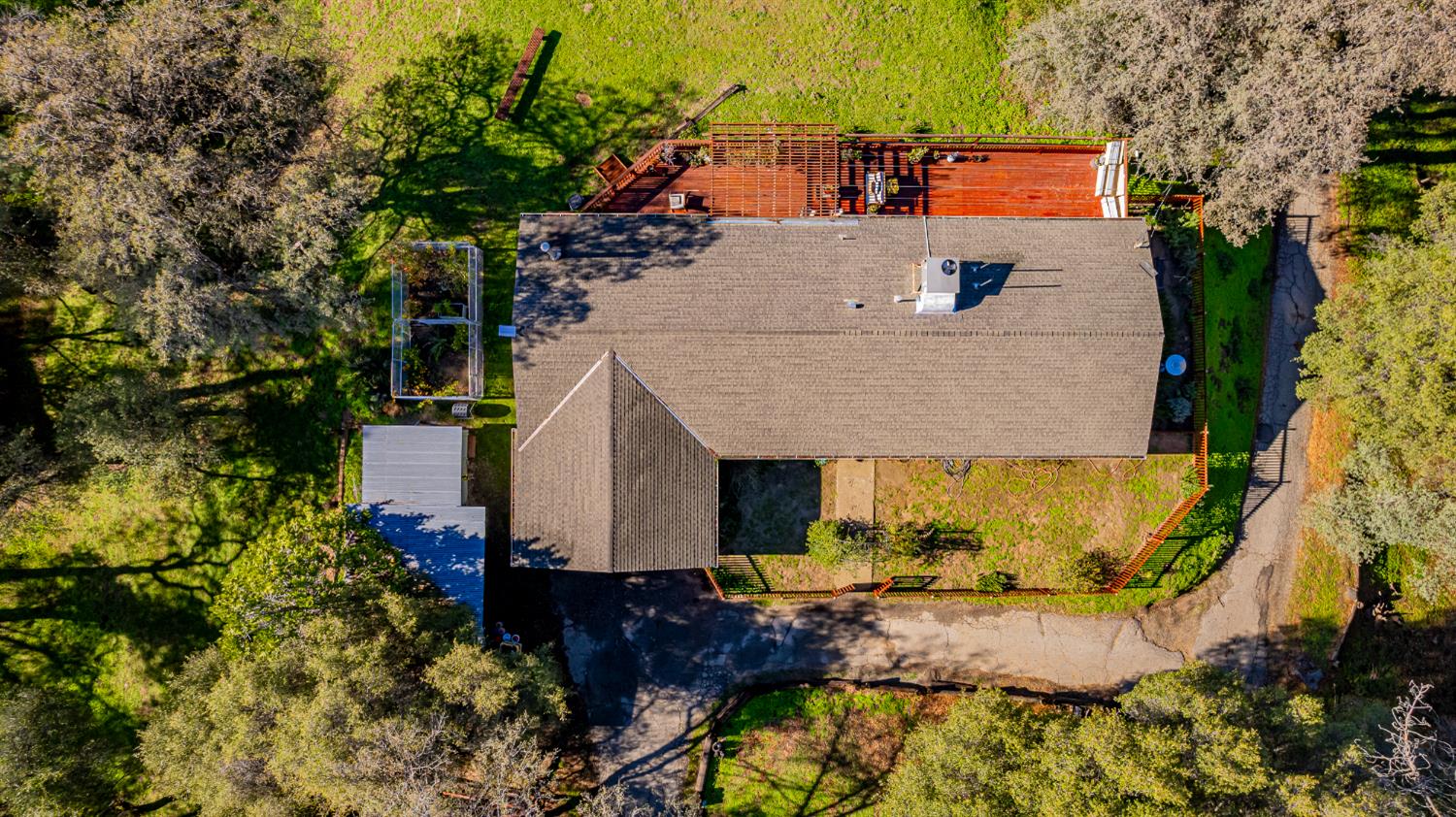 40733 Big Oak Flat Road North Oakhurst, CA 93644 - Photo 68 of 73 an aerial view of a house with a yard and large trees