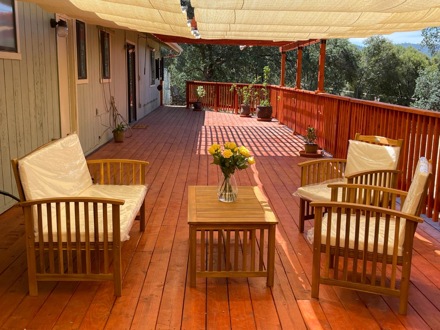 40733 Big Oak Flat Road North Oakhurst, CA 93644 - Photo 70 of 73 a view of balcony with wooden floor and outdoor seating