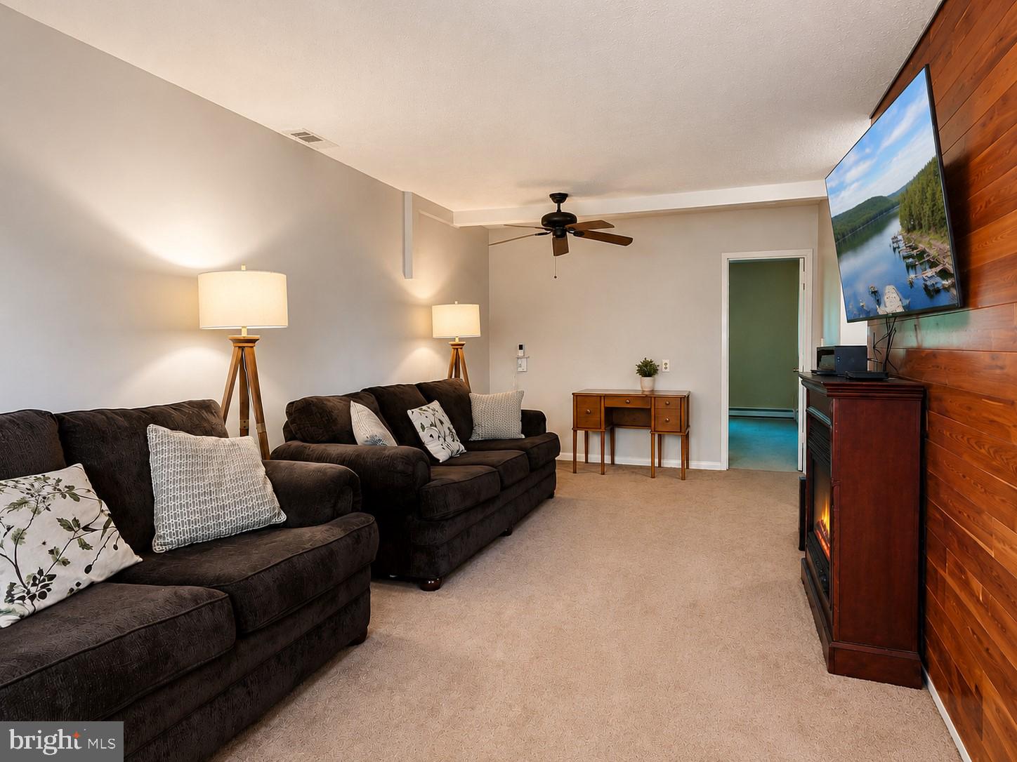 1724 Mosser Road, Unit 11 McHenry, MD 21541 - Photo 3 of 24 a living room with furniture and a lamp