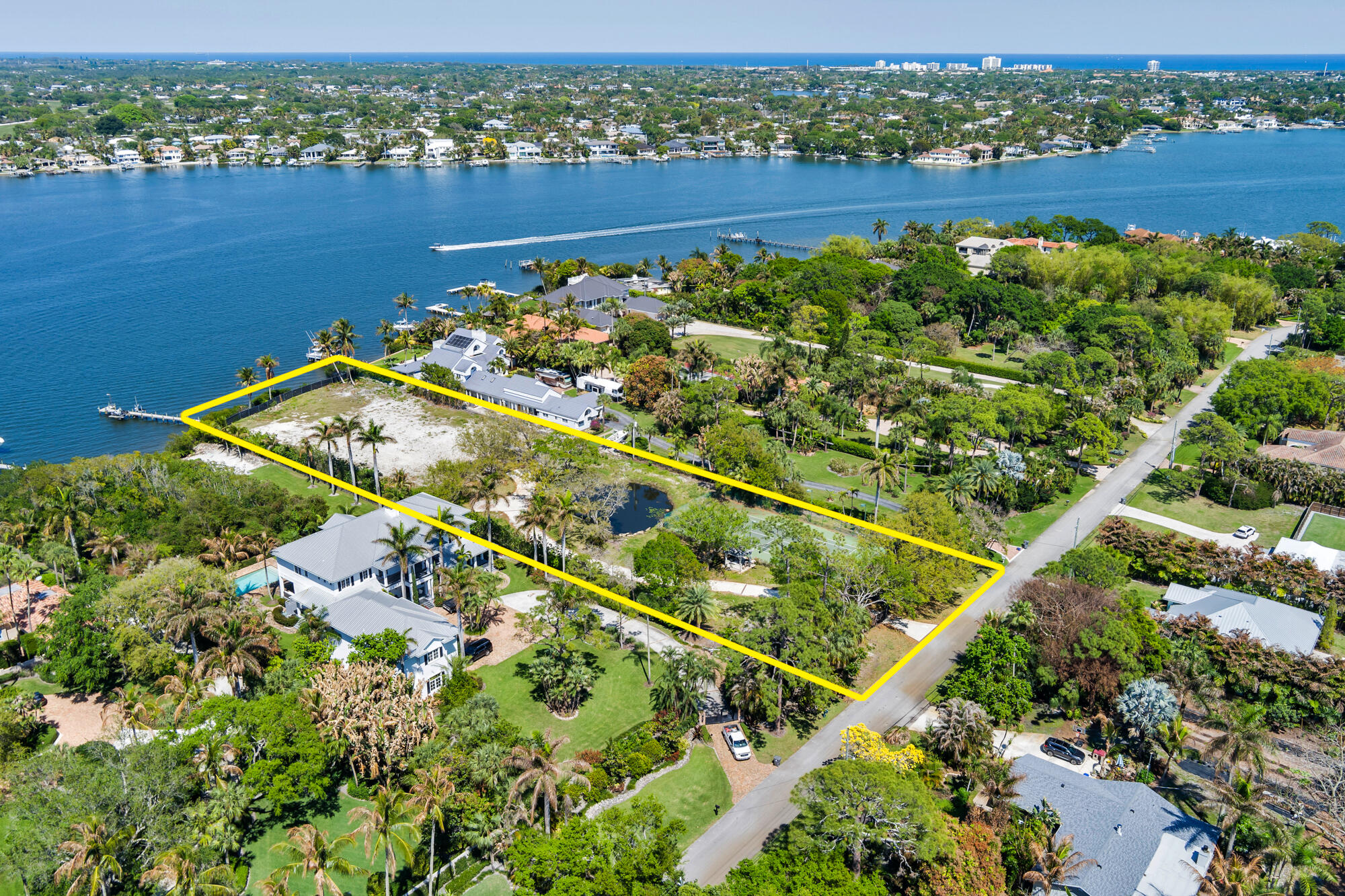 5559 Pennock Point Road Jupiter, FL 33458 - Photo 5 of 9 an aerial view of a residential houses with outdoor space and garden