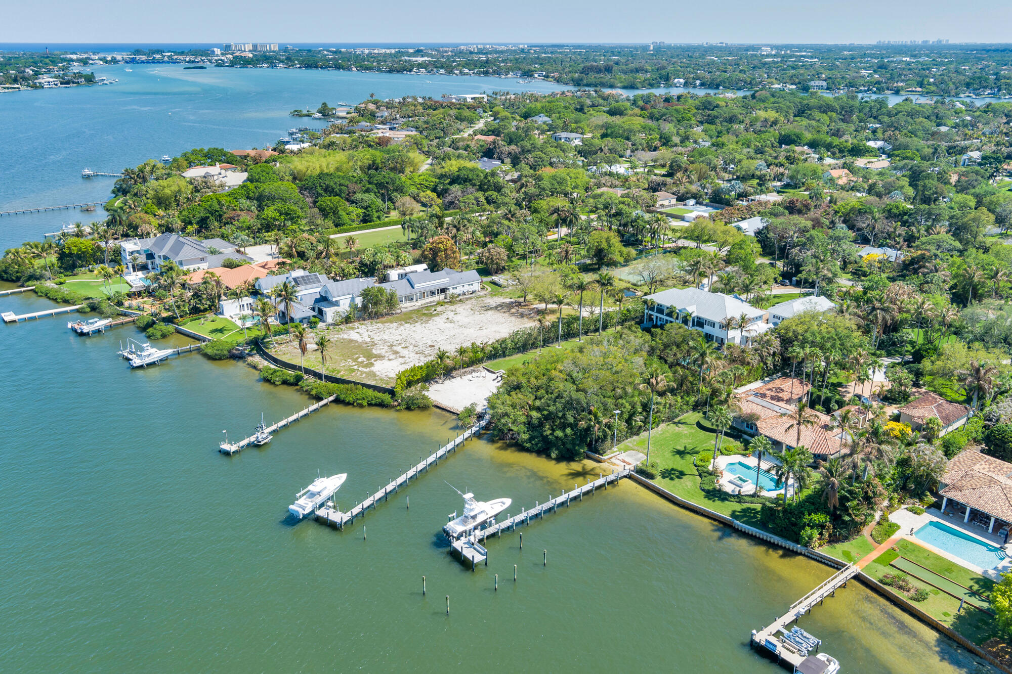 5559 Pennock Point Road Jupiter, FL 33458 - Photo 7 of 9 a view of a lake with a houses