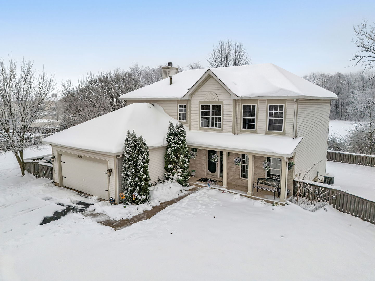 300 Wabena Court Minooka, IL 60447 - Photo 1 of 71 a view of a white house with a yard and covered with snow