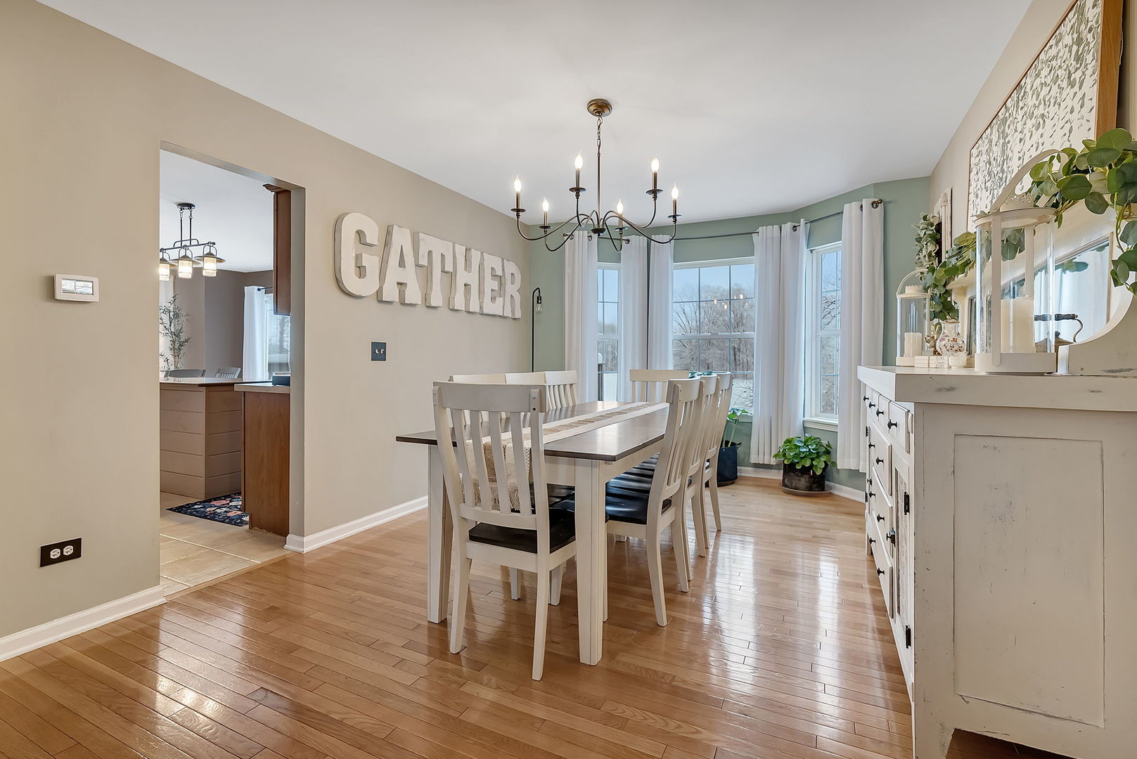 300 Wabena Court Minooka, IL 60447 - Photo 16 of 71 a view of a dining room with furniture window and wooden floor