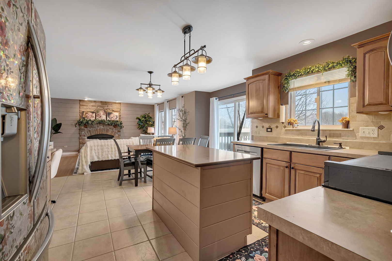 300 Wabena Court Minooka, IL 60447 - Photo 18 of 71 a kitchen with cabinets a sink dishwasher a stove and a dining table with wooden floor