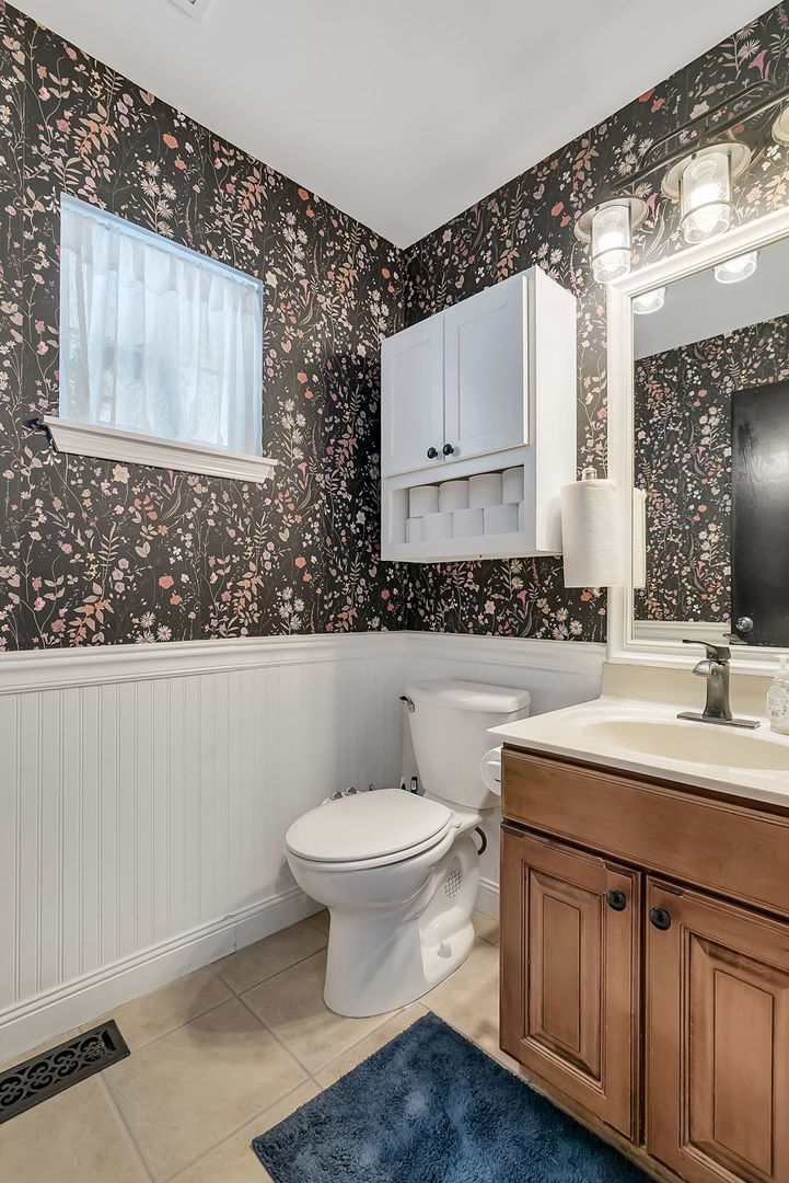 300 Wabena Court Minooka, IL 60447 - Photo 32 of 71 a bathroom with a toilet a sink and mirror