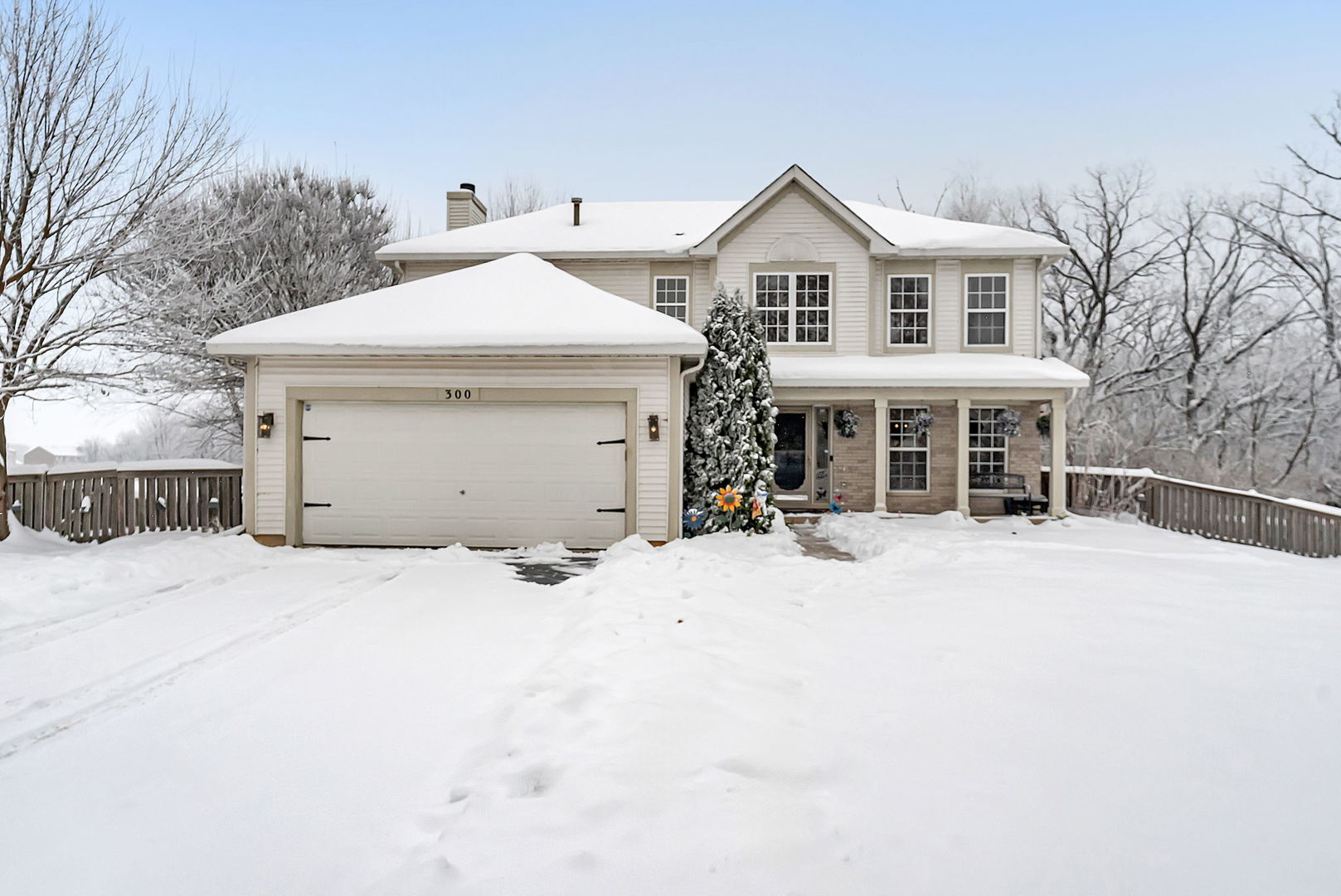 300 Wabena Court Minooka, IL 60447 - Photo 57 of 71 a front view of a house with a yard and garage