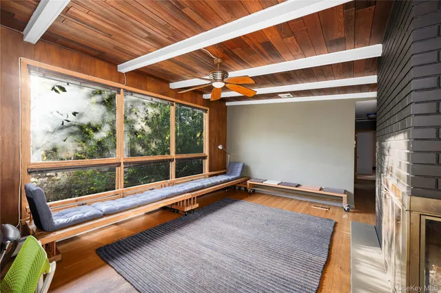 a balcony with furniture and a potted plant